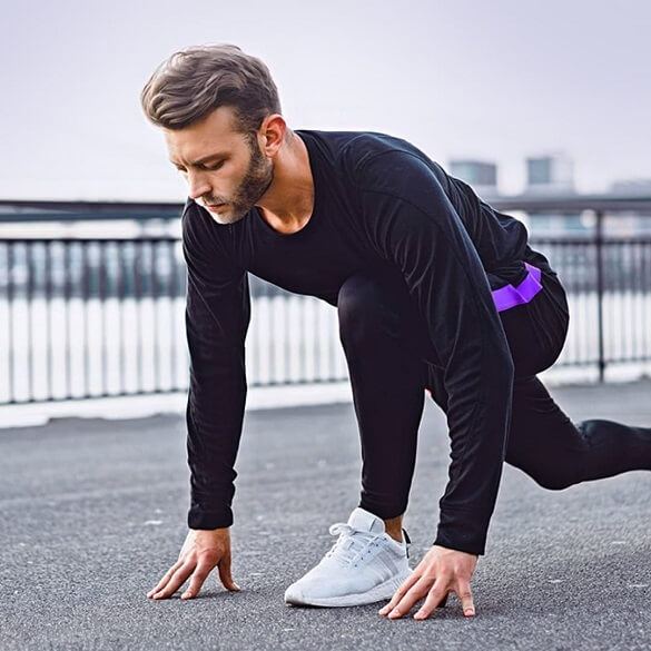 Young man stretching after a run