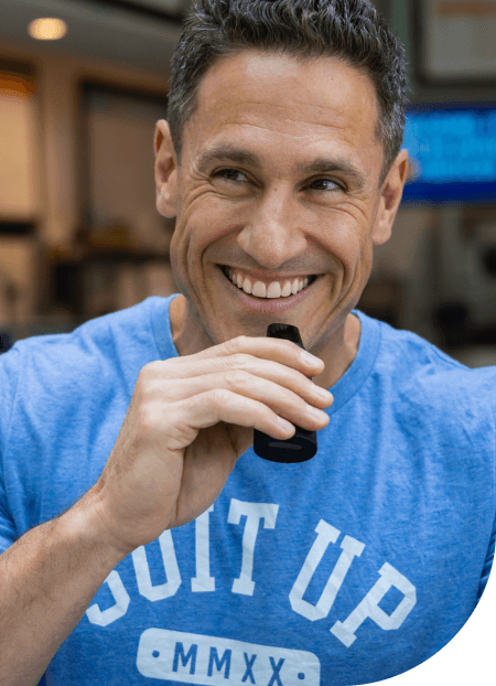 A man holding a Lumen and smiling