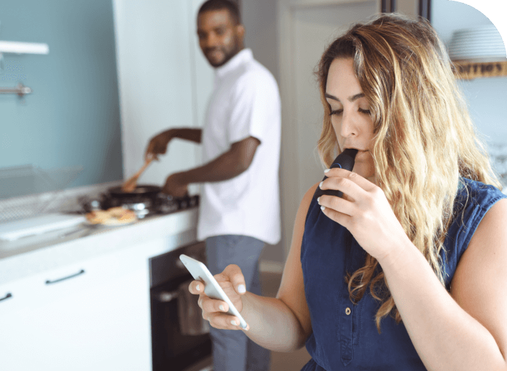 A woman exhales into a lumen device